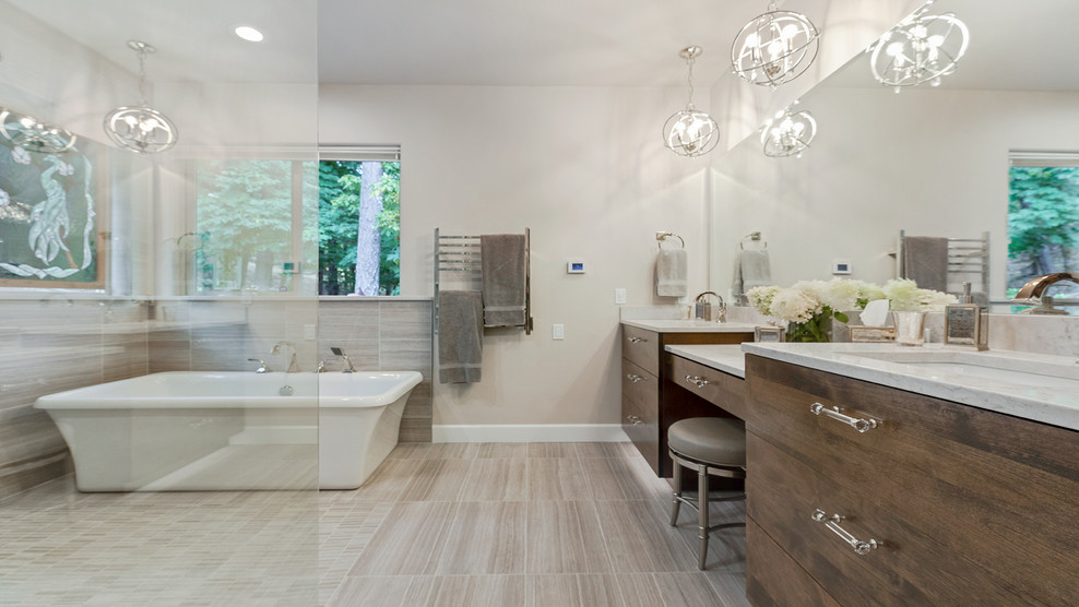 Inspiration for a large contemporary master bathroom in Other with flat-panel cabinets, dark wood cabinets, a freestanding tub, an open shower, a two-piece toilet, gray tile, grey walls, an undermount sink, quartzite benchtops, beige floor, an open shower and white benchtops.