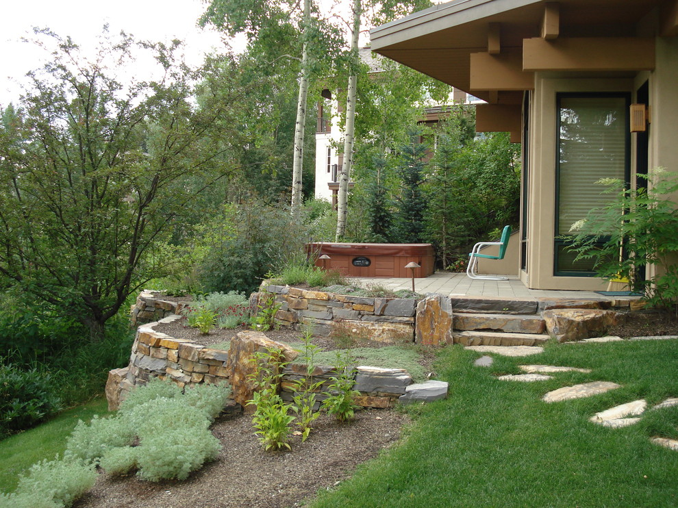 This is an example of a small traditional backyard patio in Boise with decking and no cover.
