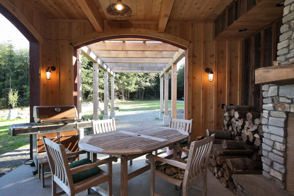 Design ideas for a country verandah in Seattle with a fire feature.