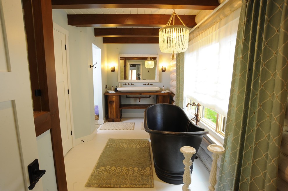 Large contemporary master bathroom in Cleveland with flat-panel cabinets, medium wood cabinets, a freestanding tub, ceramic floors, an integrated sink, wood benchtops, white floor and brown benchtops.