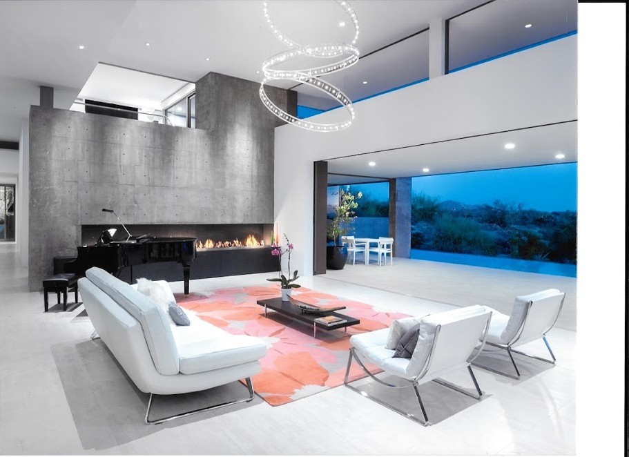 Large contemporary open concept living room in Phoenix with a music area, white walls, a ribbon fireplace, a concrete fireplace surround and white floor.
