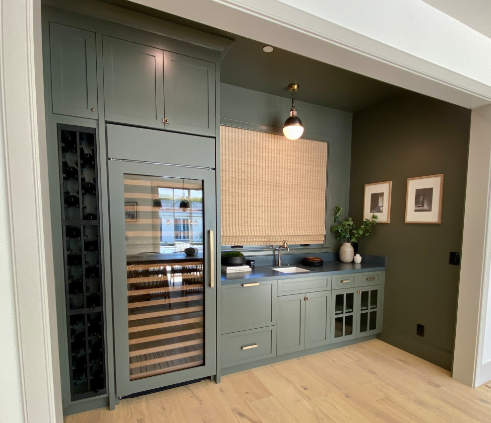 Photo of a contemporary home bar in San Francisco with shaker cabinets.