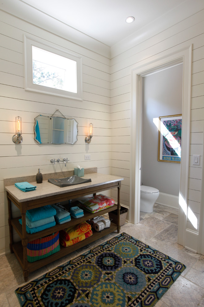 This is an example of a transitional powder room in Atlanta with a vessel sink.