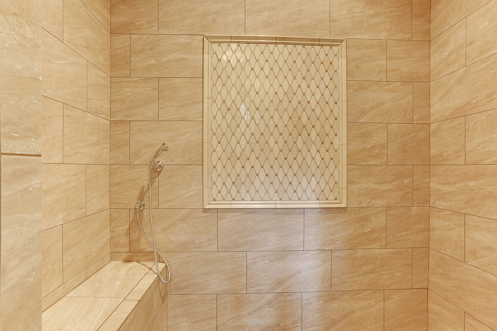 Photo of a master bathroom in Atlanta with beige tile.