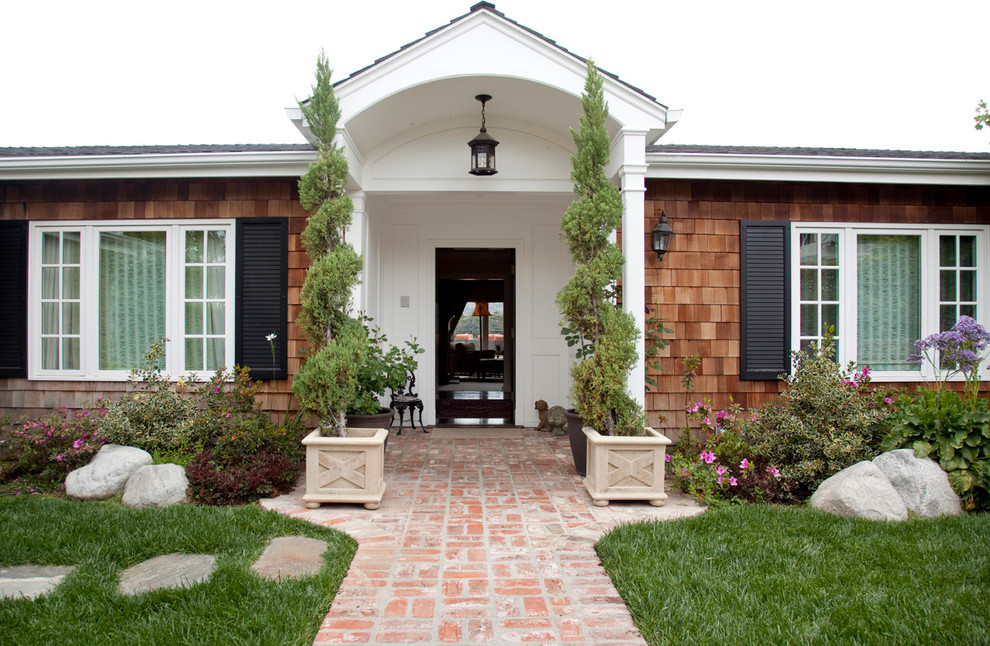 Traditional entryway in Los Angeles with a single front door.