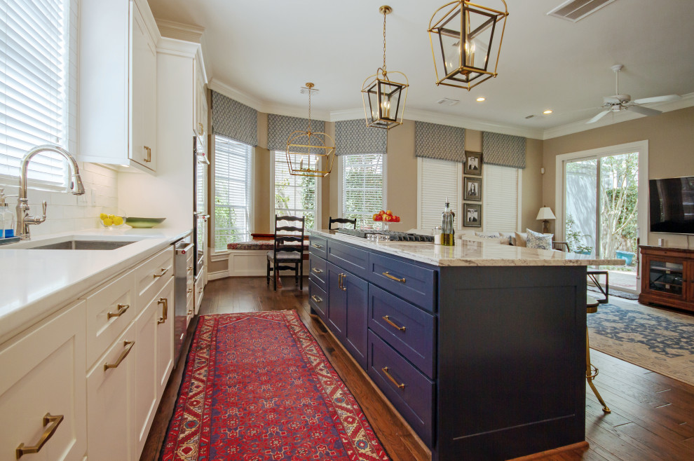 This is an example of a mid-sized transitional kitchen in Houston.