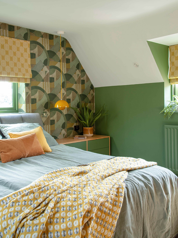 Small midcentury master bedroom in West Midlands with green walls, carpet, beige floors, a vaulted ceiling and wallpapered walls.