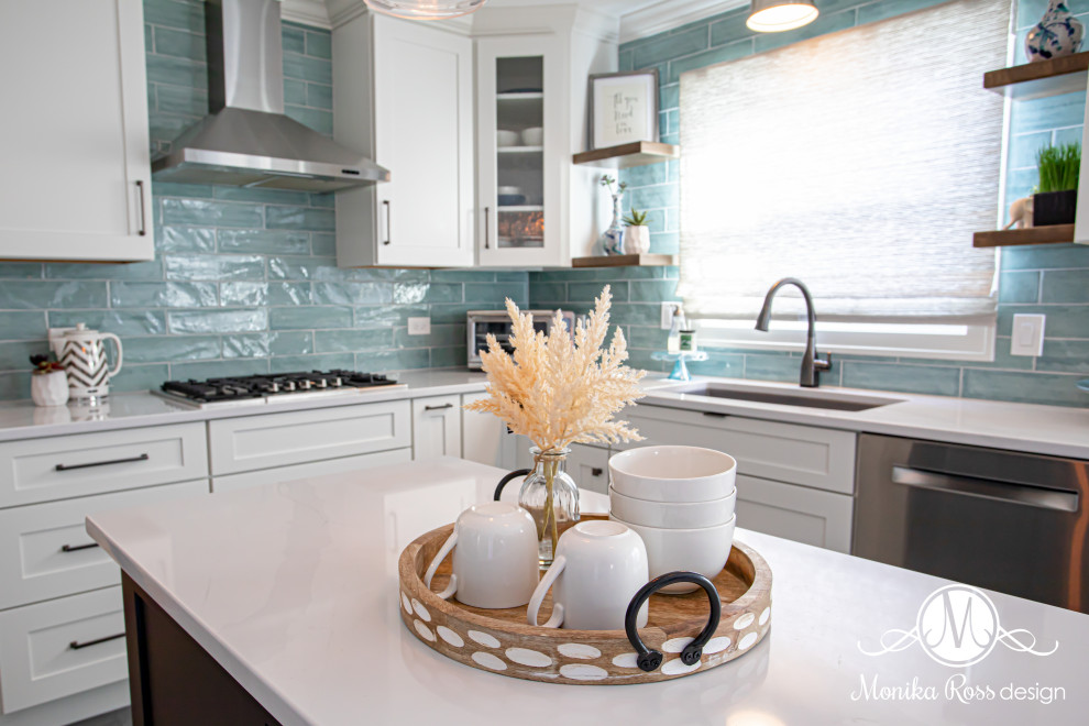 Large beach style u-shaped vinyl floor and gray floor eat-in kitchen photo in Chicago with an undermount sink, shaker cabinets, white cabinets, quartz countertops, blue backsplash, ceramic backsplash, stainless steel appliances, an island and white countertops