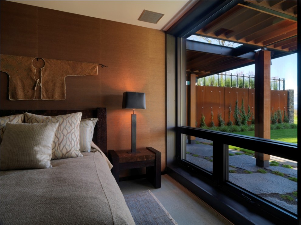 Inspiration for a large country master bedroom in Burlington with brown walls.