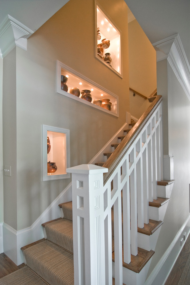 Inspiration for a traditional wood l-shaped staircase in New York with painted wood risers.