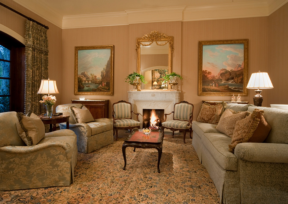 Photo of a mid-sized mediterranean formal enclosed living room in Houston with beige walls, carpet, a standard fireplace, a plaster fireplace surround and no tv.