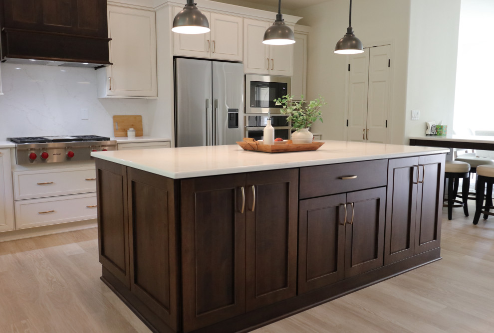 Kitchen - large transitional l-shaped kitchen idea with an undermount sink, recessed-panel cabinets, quartz countertops, white backsplash, quartz backsplash, stainless steel appliances and white countertops