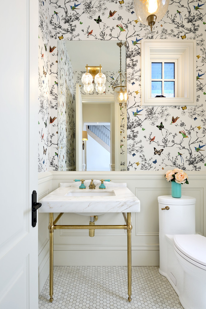 Small traditional powder room in Toronto with a one-piece toilet, multi-coloured walls, a console sink, furniture-like cabinets, marble floors, marble benchtops and white floor.