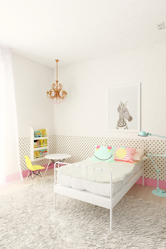 This is an example of a mid-sized scandinavian gender-neutral kids' bedroom for kids 4-10 years old in Madrid with white walls and light hardwood floors.