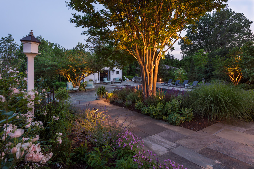 Example of a large transitional backyard stone and rectangular lap pool design in DC Metro
