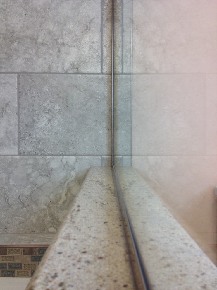 Inspiration for a mid-sized transitional kids' gray tile and porcelain tile porcelain tile alcove bathtub remodel with an undermount sink, raised-panel cabinets, white cabinets, granite countertops and orange walls