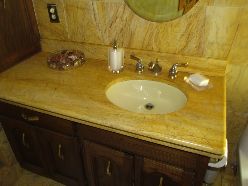 Example of a classic yellow tile and stone slab alcove shower design in Seattle with an undermount sink, beaded inset cabinets, dark wood cabinets, marble countertops and a one-piece toilet