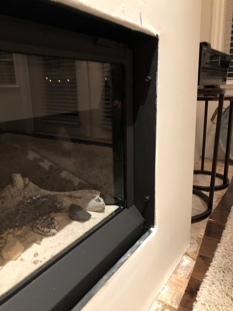 Gap between fireplace insert & drywall/tile