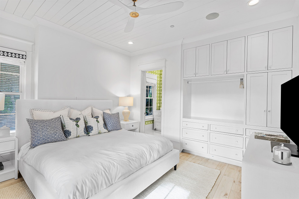 Design ideas for a medium sized beach style guest bedroom in Other with white walls, light hardwood flooring, beige floors and a timber clad ceiling.