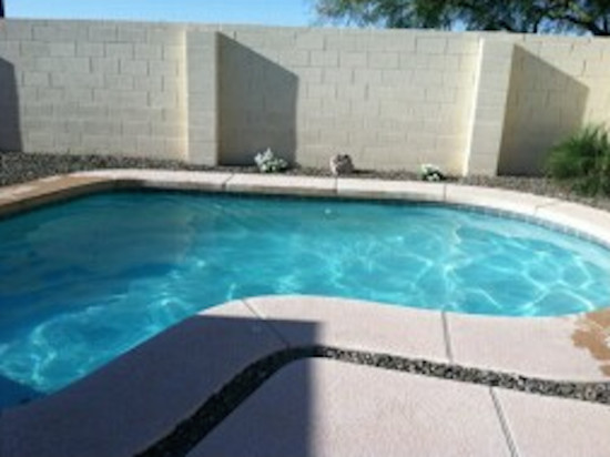Inspiration for a backyard custom-shaped natural pool remodel in Phoenix