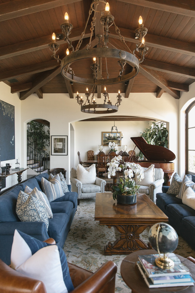 Inspiration for a large mediterranean open concept living room in Los Angeles with a music area, white walls, dark hardwood floors and brown floor.
