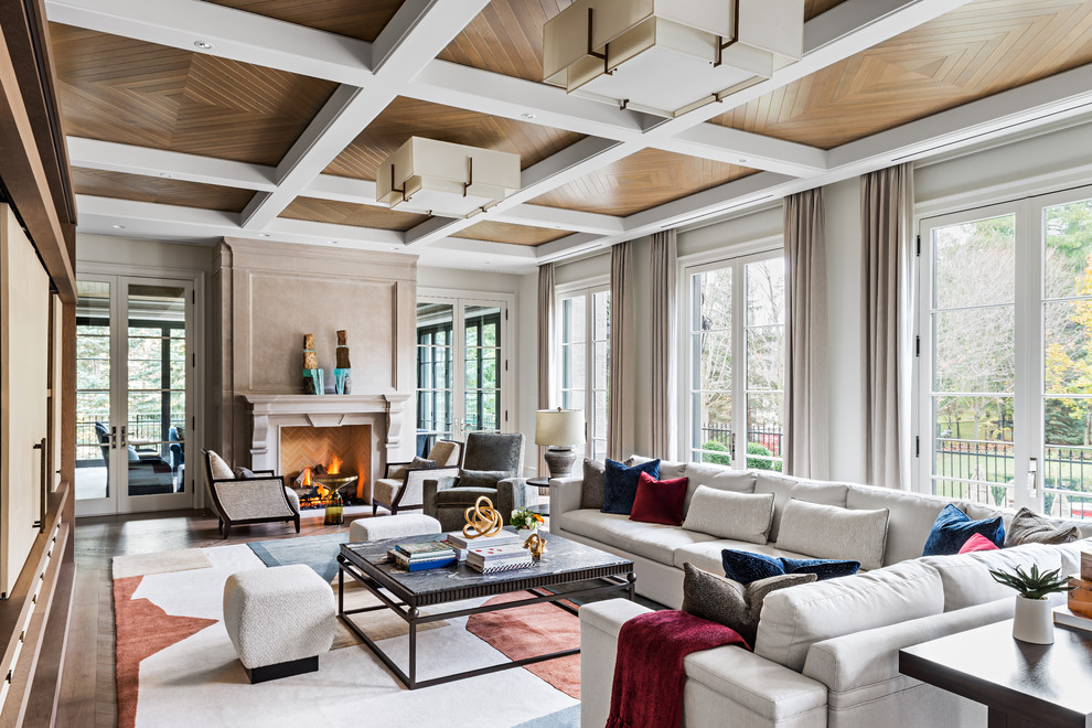 This is an example of a large transitional formal open concept living room in Toronto with white walls, light hardwood floors, a two-sided fireplace, a stone fireplace surround, no tv and beige floor.