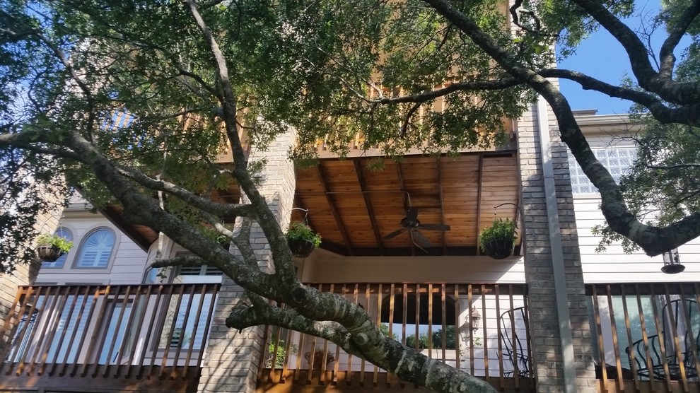Mid-sized transitional backyard deck photo in Austin with a fire pit and no cover