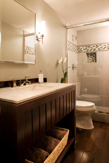 Photo of a mid-sized contemporary 3/4 bathroom in Portland with open cabinets, dark wood cabinets, an alcove shower, grey walls, dark hardwood floors, an undermount sink, a one-piece toilet and marble benchtops.