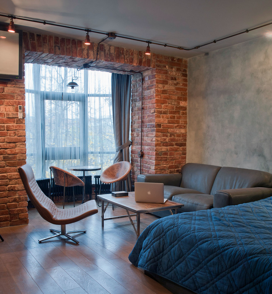 This is an example of an industrial living room in Moscow with medium hardwood floors.