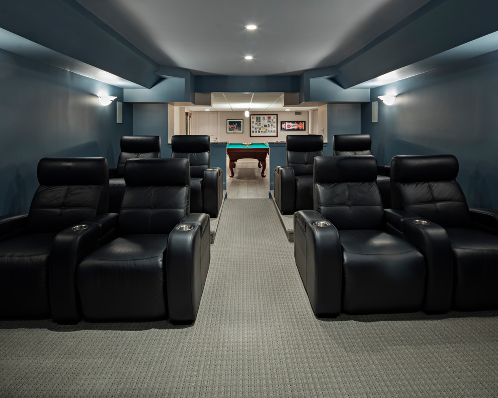 Design ideas for a large transitional home theatre in New York with beige walls, laminate floors and grey floor.