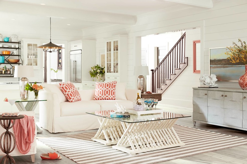 Design ideas for a mid-sized beach style formal open concept living room in Orlando with white walls, light hardwood floors, no fireplace and no tv.