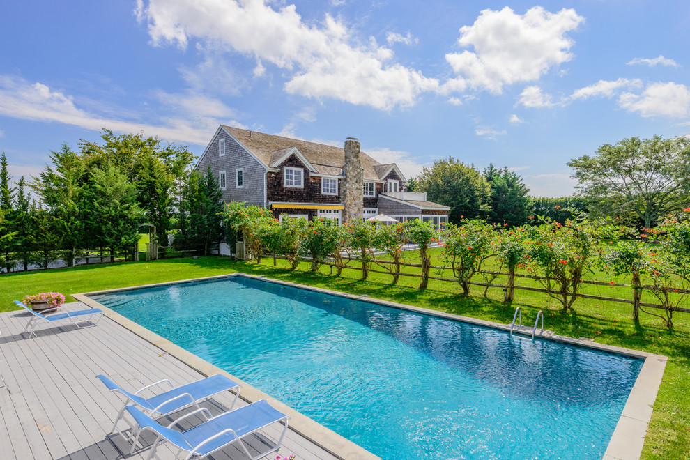 Traditional rectangular lap pool in New York with decking.