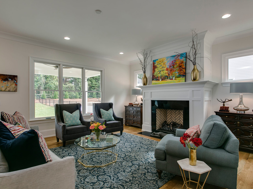Inspiration for a transitional open concept living room in Raleigh with medium hardwood floors.