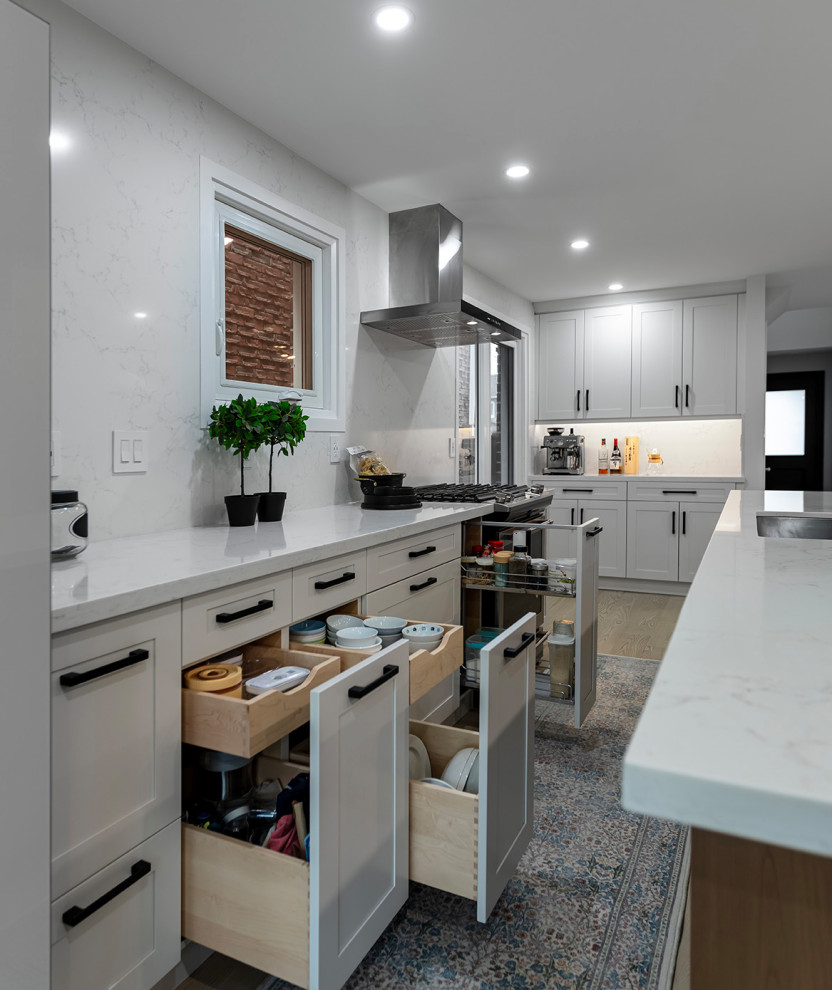 Example of a transitional kitchen design in Toronto