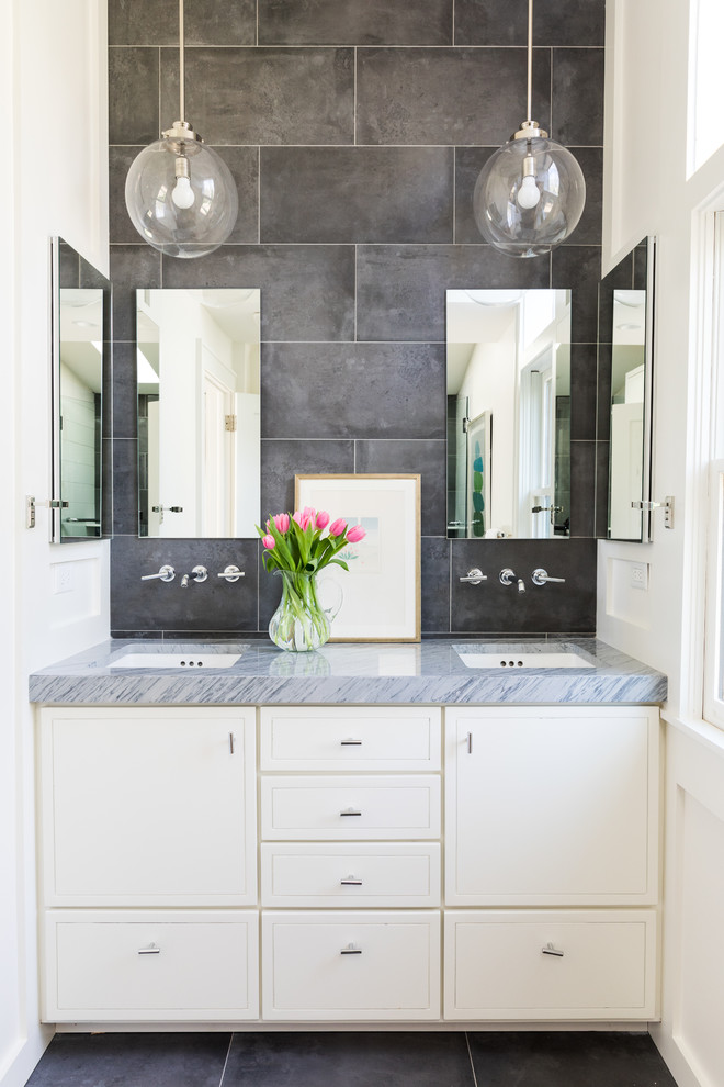 This is an example of a mid-sized midcentury bathroom in Atlanta with flat-panel cabinets, white cabinets, porcelain tile, white walls, porcelain floors, an undermount sink, marble benchtops, grey floor, grey benchtops and gray tile.
