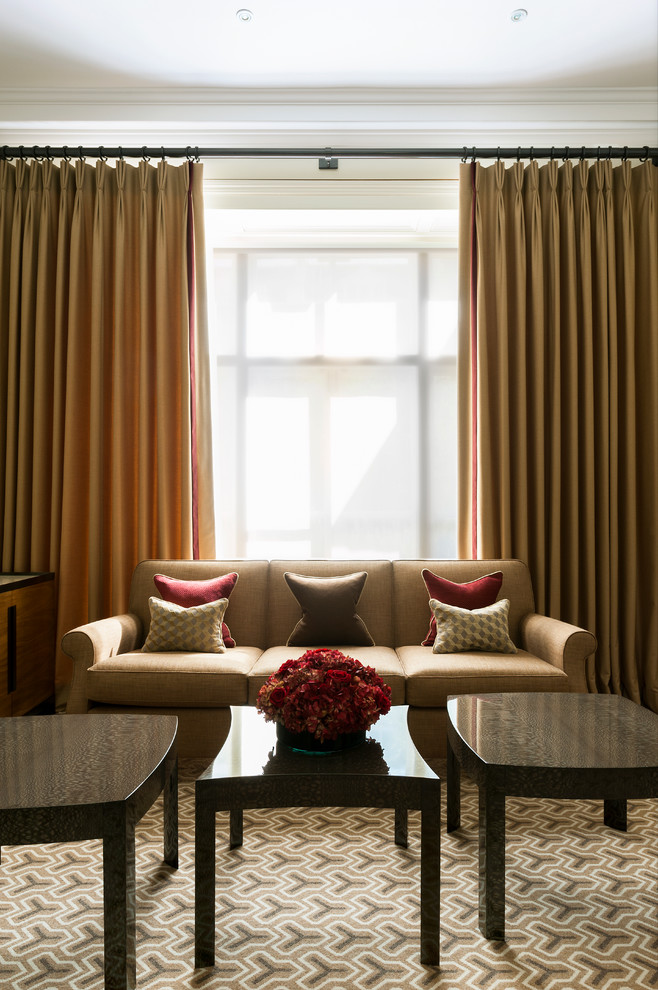 This is an example of a mid-sized midcentury formal open concept living room in London with beige walls and no tv.