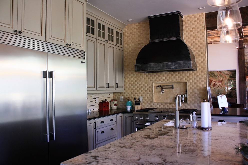 Open concept kitchen - huge rustic l-shaped open concept kitchen idea with an undermount sink, quartz countertops, beige backsplash, stone tile backsplash, stainless steel appliances and an island