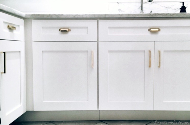 Eat-in kitchen - small transitional painted wood floor and white floor eat-in kitchen idea with an undermount sink, shaker cabinets, white cabinets, marble countertops, white backsplash, marble backsplash, stainless steel appliances, no island and white countertops
