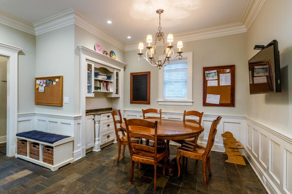 Photo of an expansive traditional kitchen/dining combo in Cleveland with slate floors and multi-coloured floor.