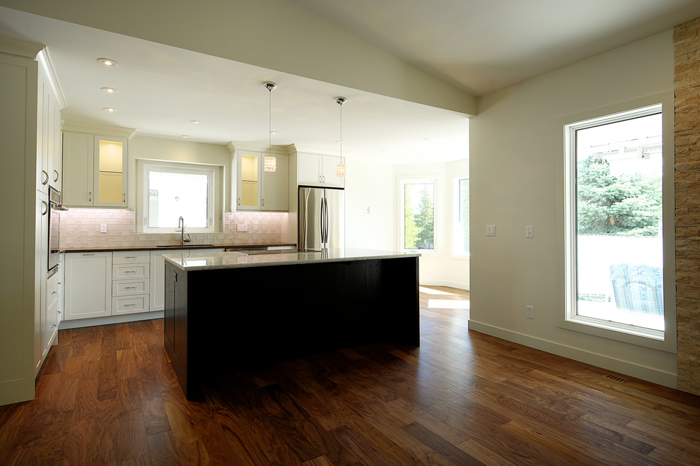 Example of a transitional kitchen design in Calgary
