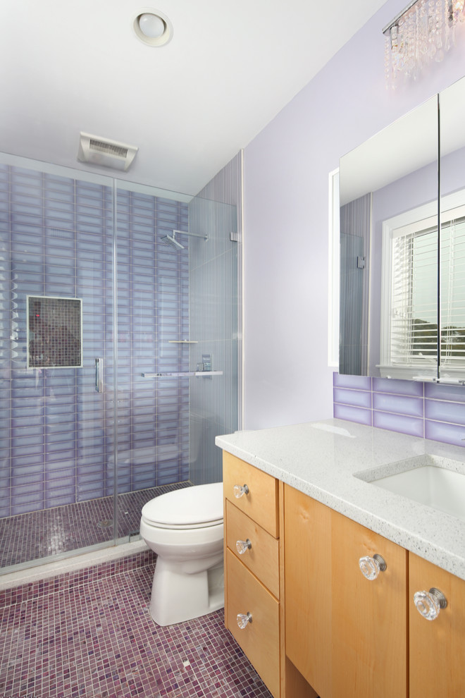 Inspiration for a small contemporary kids bathroom in Boston with flat-panel cabinets, light wood cabinets, an open shower, a one-piece toilet, porcelain tile, purple walls, mosaic tile floors, an integrated sink, engineered quartz benchtops, brown floor and a hinged shower door.
