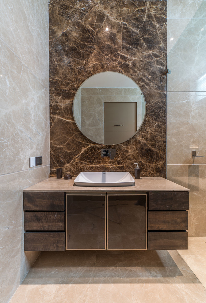 Photo of a contemporary bathroom in Hyderabad with flat-panel cabinets, brown cabinets, beige tile, brown tile, a drop-in sink, beige floor and beige benchtops.