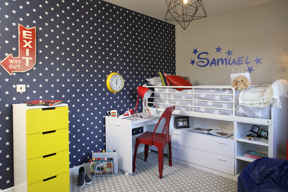Photo of a mid-sized contemporary gender-neutral kids' room in Oxfordshire with beige walls and multi-coloured floor.