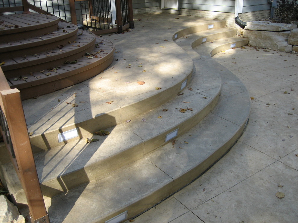 Large transitional backyard concrete paver and rectangular natural pool house photo in Cedar Rapids