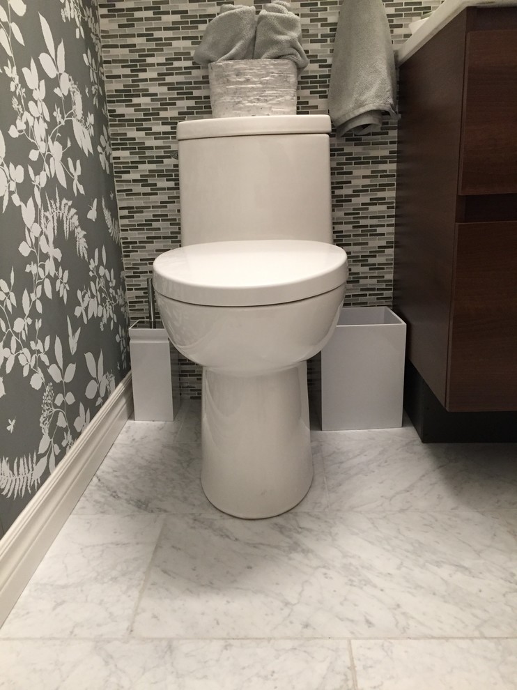 Inspiration for a small contemporary bathroom in Ottawa with furniture-like cabinets, dark wood cabinets, an alcove tub, a shower/bathtub combo, a one-piece toilet, white tile, marble, grey walls, marble floors, an undermount sink and engineered quartz benchtops.