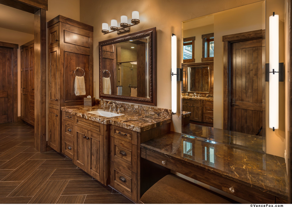Large country master bathroom in Other with an undermount sink, recessed-panel cabinets, distressed cabinets, marble benchtops, beige walls and porcelain floors.