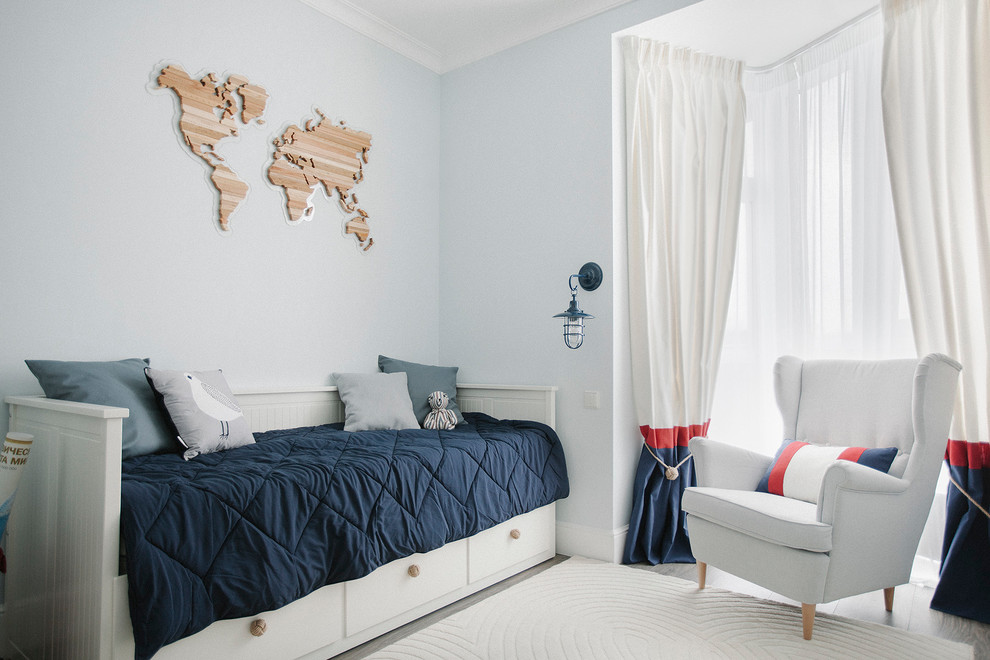 Photo of a beach style gender-neutral kids' room in Moscow with blue walls, dark hardwood floors and grey floor.