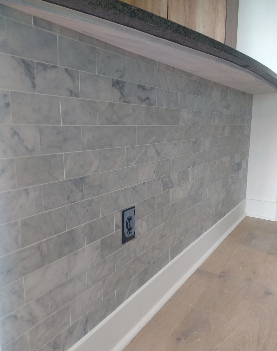 Midtown high-rise marble tile bathroom.