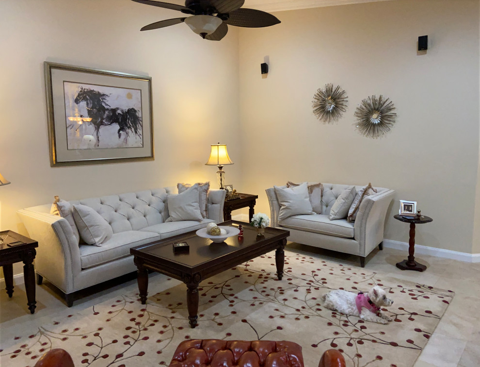 This is an example of a large transitional formal enclosed living room in Other with beige walls and green floor.