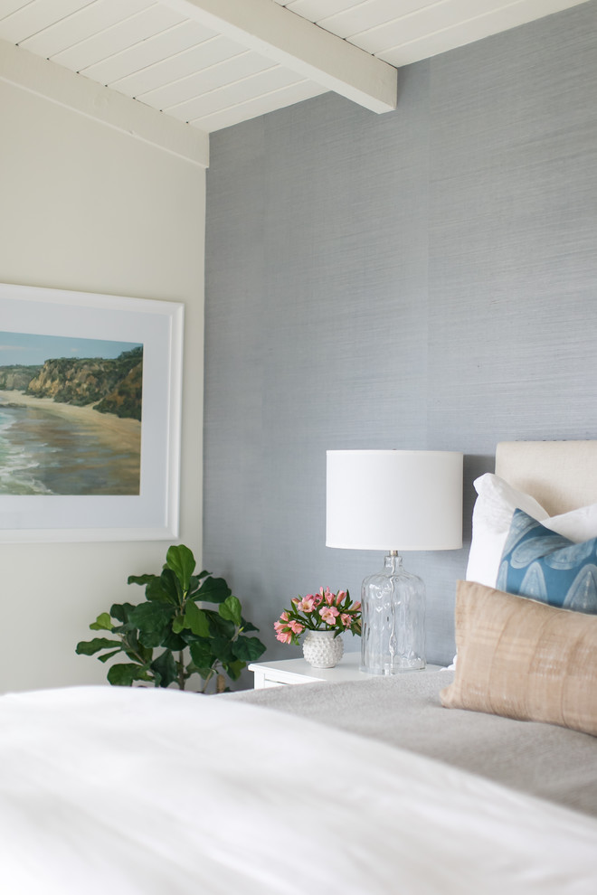 Design ideas for a beach style master bedroom in Orange County with grey walls, carpet and grey floor.